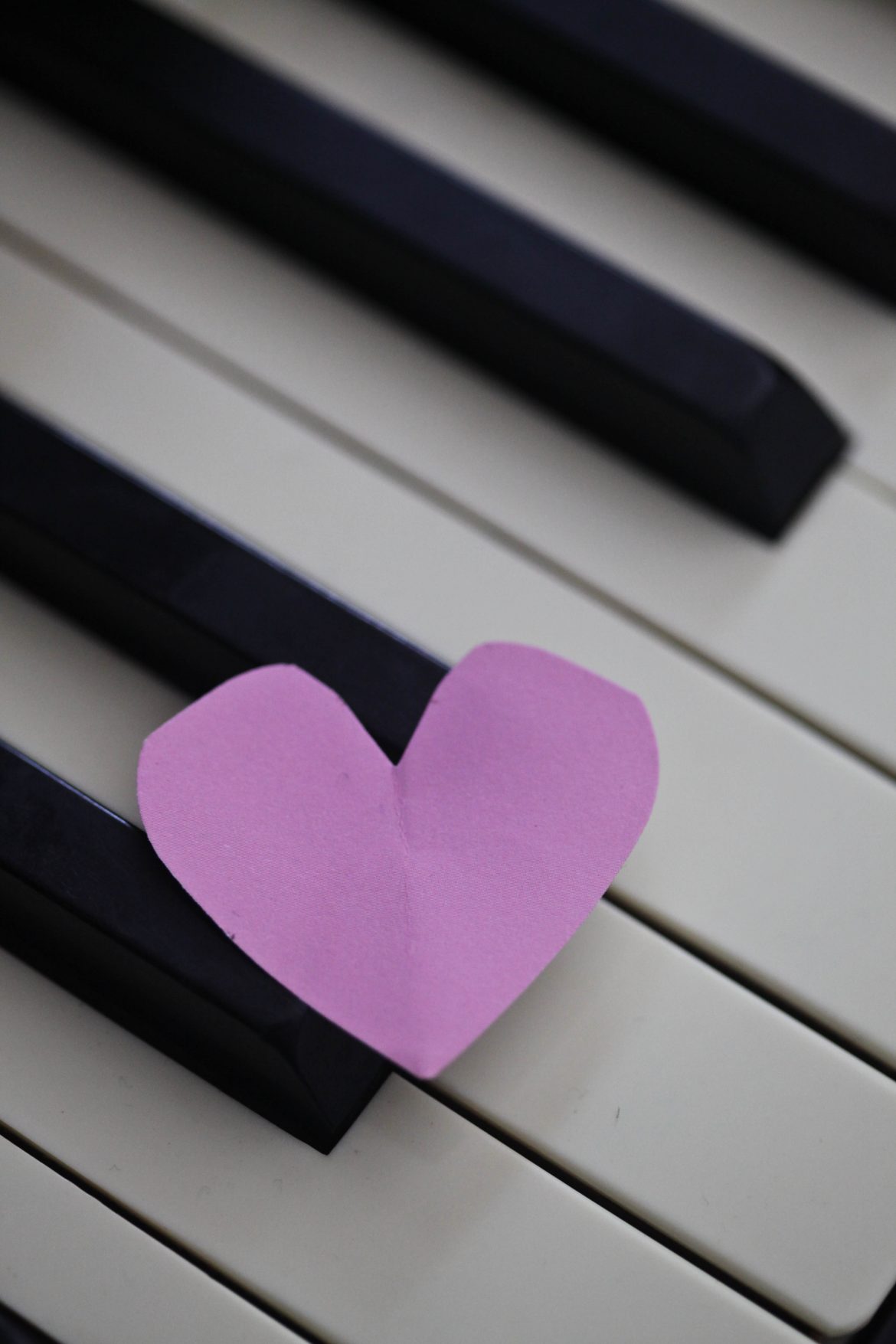 cut out paper heart on keyboard