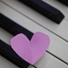 cut out paper heart on keyboard