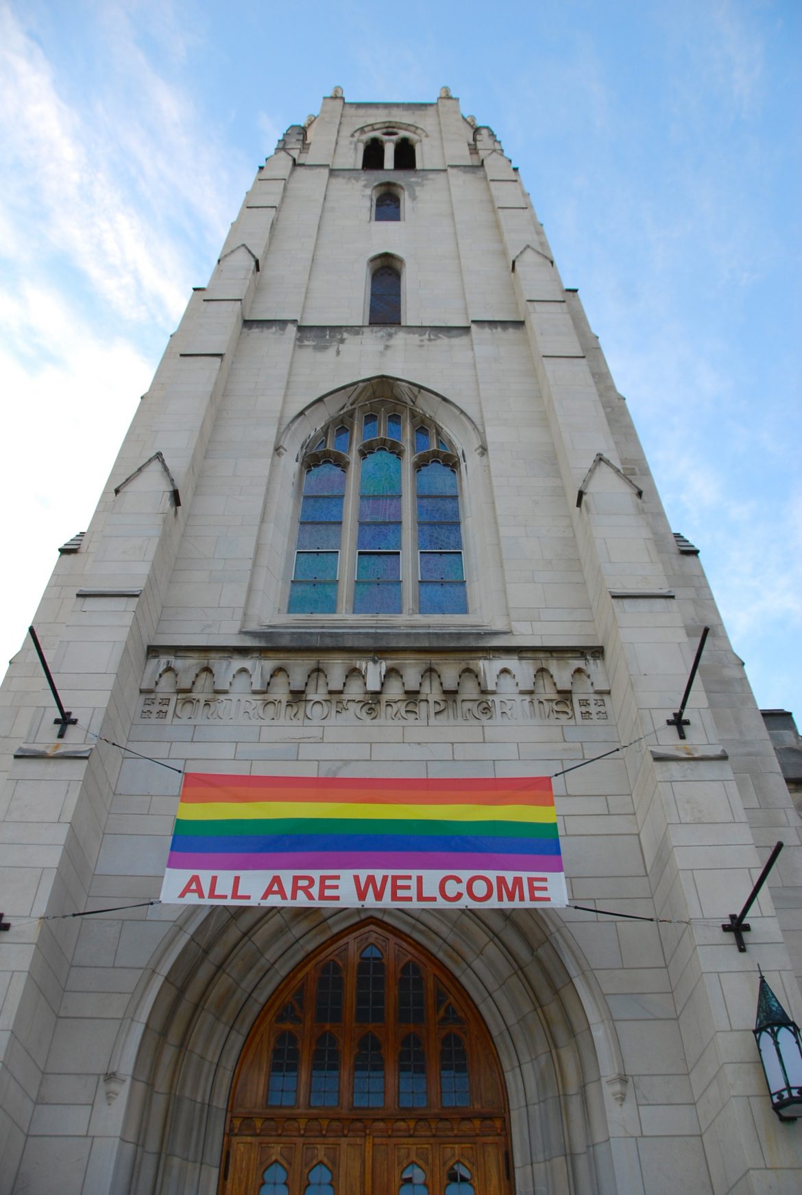 church with LGBTQ flag hanging in front