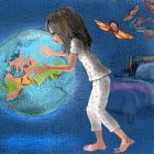 Young girl dreaming of touching giant globe of the world