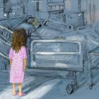 Young girl staring at hospital bed with patient in it