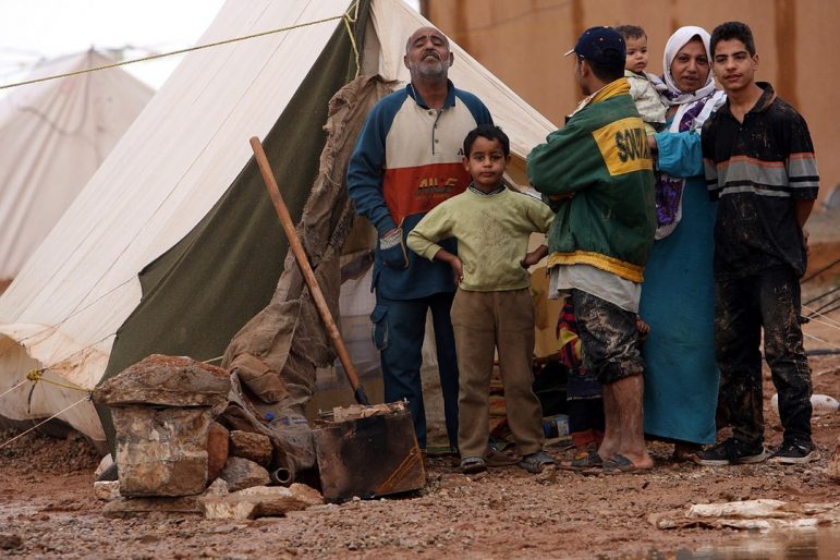 Photo: “Palestinian Iraqi IDP family near Jordanian border” Graham A. Paulsgrove, 2006; Wikimedia Commons