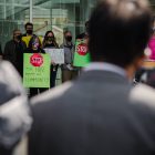 people standing in front of glass building during daytime