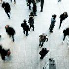 people walking on grey concrete floor during daytime